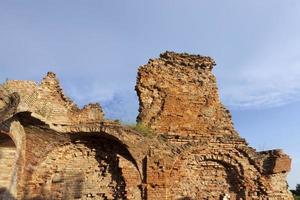 ruins of an ancient red clay brick castle photo