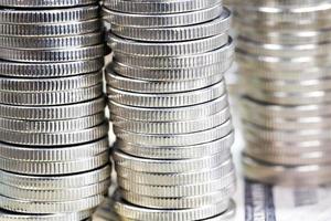 coins of silver color stacked together photo