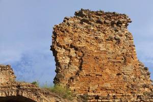 ruins of an ancient red clay brick castle photo