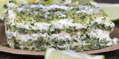 green cake with cream and lime photo