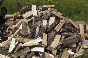 wood cut into logs for use in a stove or fireplace photo