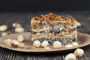 sweet cake with buttercream and sponge cake and lots of poppy seeds and nuts photo
