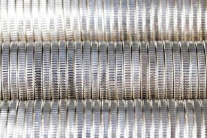 coins of silver color stacked together photo