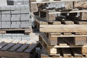 empty wooden pallets and new construction tiles photo