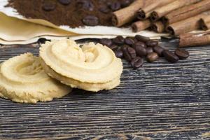 cinnamon, cookies and aromatic coffee beans photo