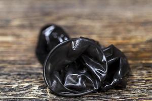 quality latex condoms in black color photo