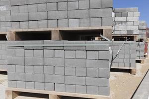 Packed on new wooden pallets, concrete tiles photo