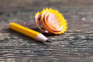 sharpening one single color wooden pencils photo