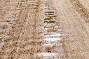 part of a sandy road in the countryside photo