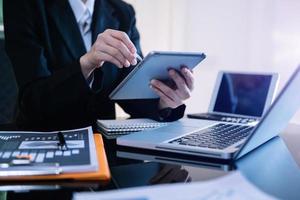 businessman hand working with new modern computer and writing on the notepad strategy diagram as concept photo