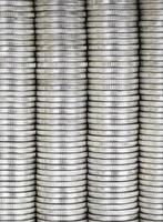 coins of silver color stacked together photo