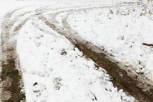 traces of the car in the snow photo