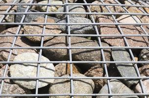 Stones in a metal grid photo