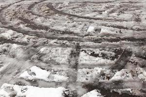 traces of the car on snow photo