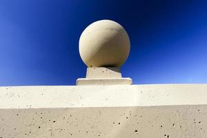 round concrete ornaments on railings photo