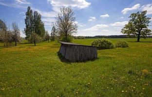 old wooden shed located on the farm. spring photo