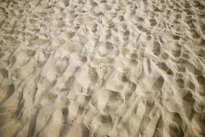 wavy uneven structure of sand photo