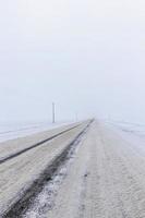 dirty snow on the road photo