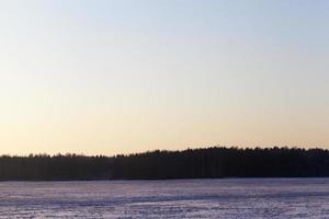 Winter landscape in the field photo
