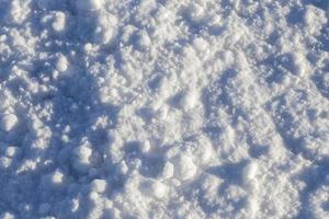 Snow after snowfall   snow lying in snowdrifts after the last snowfall. Photo in the winter in the field.