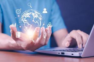 Man  holding virtual Global Internet connection metaverse. Business global internet connection application technology and digital marketing, Financial and banking, Digital link tech, big data. photo
