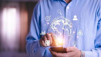 Man  holding virtual Global Internet connection metaverse. Business global internet connection application technology and digital marketing, Financial and banking, Digital link tech, big data. photo