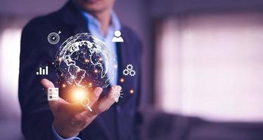 Man  holding virtual Global Internet connection metaverse. Business global internet connection application technology and digital marketing, Financial and banking, Digital link tech, big data. photo