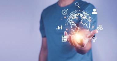 Man  holding virtual Global Internet connection metaverse. Business global internet connection application technology and digital marketing, Financial and banking, Digital link tech, big data. photo