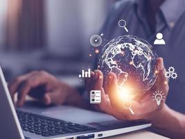 Man  holding virtual Global Internet connection metaverse. Business global internet connection application technology and digital marketing, Financial and banking, Digital link tech, big data. photo