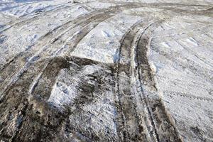 details of snow covered road photo