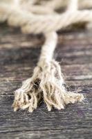 broken and untangled thick linen rope photo