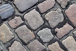 Detailed close up on old historical cobblestone roads and walkways photo