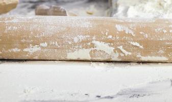 white wheat flour on a wooden table photo