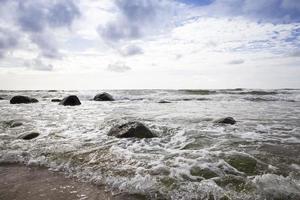 sea coast with lots of waves from windy weather photo