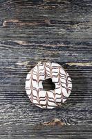 delicious doughnuts with chocolate covered filling, close up photo