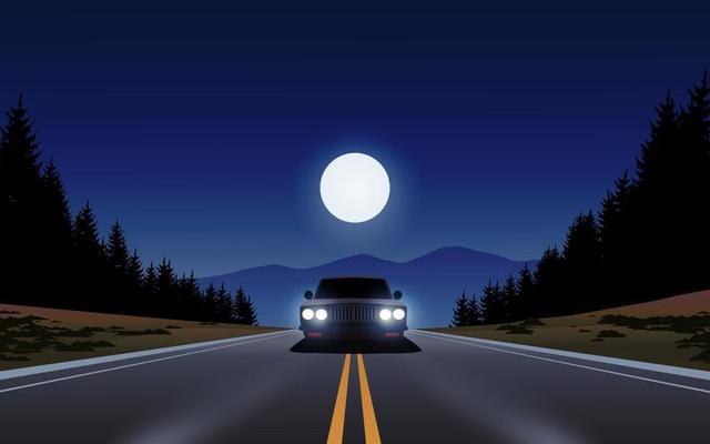 Car driving in forest road under the full moon