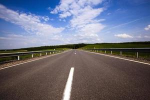 the road - the road asphalted. summertime of year. Belarus photo