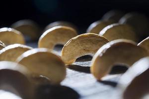 dried cashew nuts on a wooden table photo