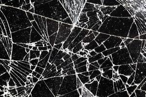 broken thin glass with lots of cracks photo