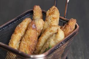 deep fried chicken pieces cut into long pieces photo