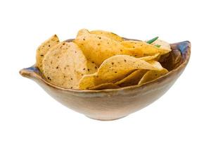 Potato chips in a bowl on white background photo