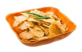 Potato chips in a bowl on white background photo