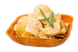 Potato chips in a bowl on white background photo