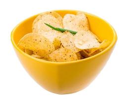 Potato chips in a bowl on white background photo