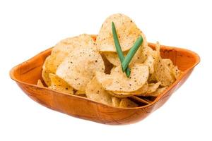 Potato chips in a bowl on white background photo