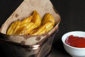 deep fried baked potato slices, quickly cooked potato slices photo