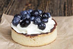 tartlet with chocolate and buttercream with blueberries photo