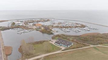 Aerial footage of Brondby Havn harbour in Copenhagen on a cloudy day 1080p video