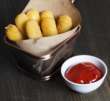 large cheese sticks made of deep fried baked cheese photo