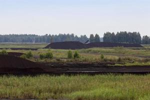 the flooded area where peat is extracted photo